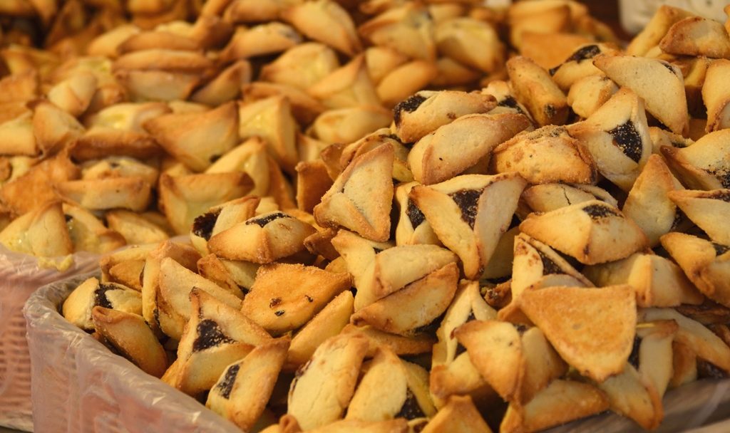 Hamentaschen piled up in Machane Yehuda Market for Purim 