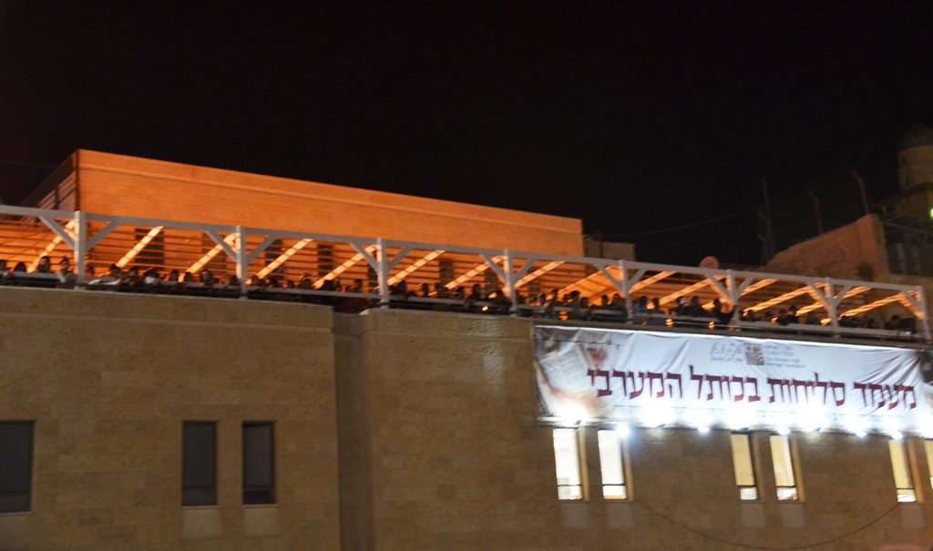 New police station and roof of building near Kotel for selihot