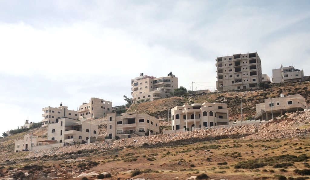 Arab houses being built along road outside of Jerusalem Israel