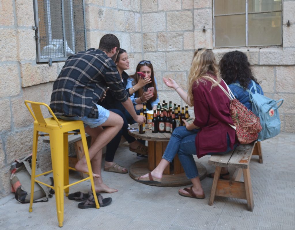 Beit Alliance courtyard people talking 