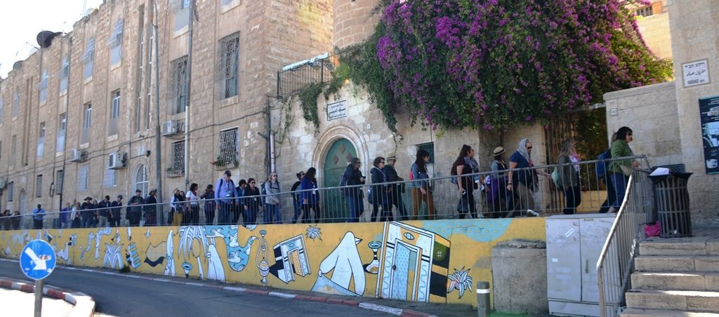 Line of tourists going into Jewish Quarter Old City Jerusalem Israel 