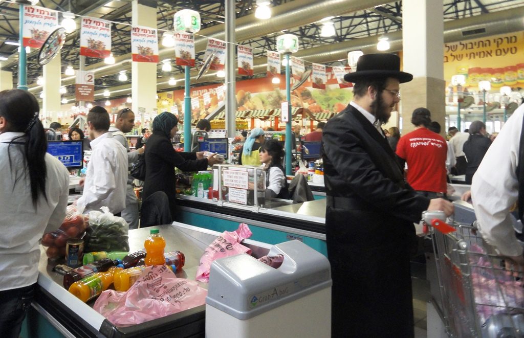 Muslim woman shopping before Pesach in Rami Levi Supermarket in Har Nof