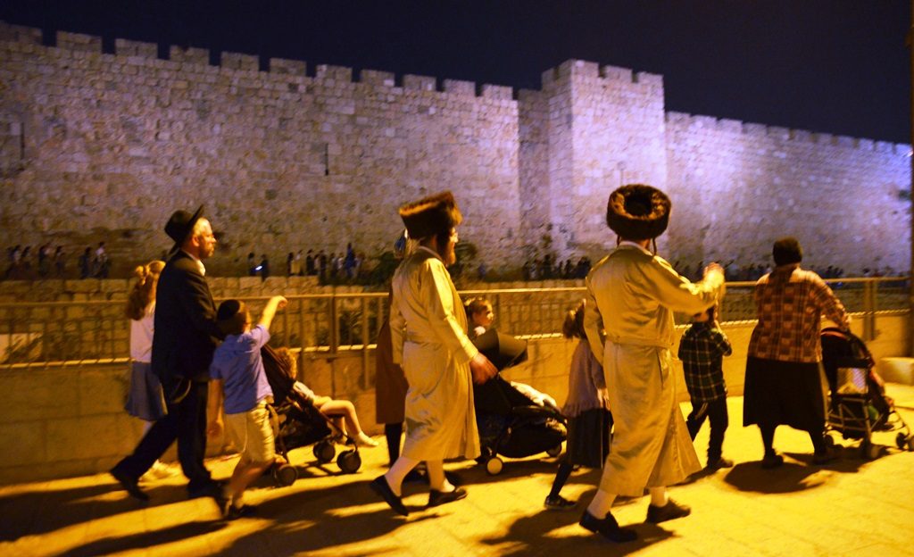 Jerusalem on Sukkot holiday people dressed in holiday clothing.