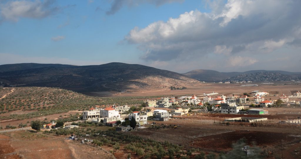 West Bank Israel scene from road of small village and rolling hills