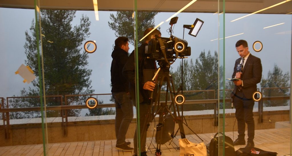 Fog covering the view of Jerusalem as TV reporter speaks from Yad Vashem
