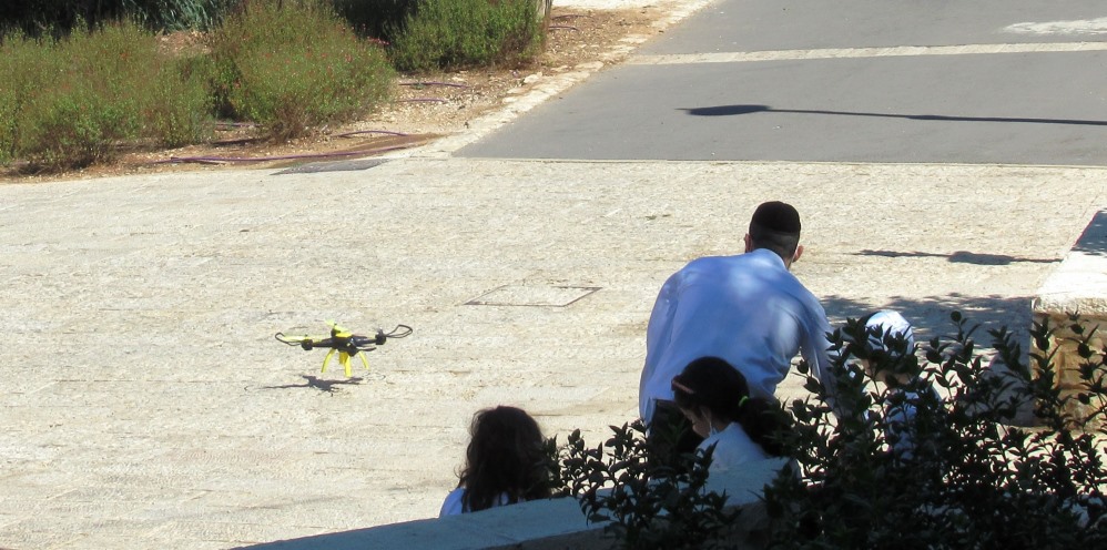 Family with a flying toy in Jerusalem park 