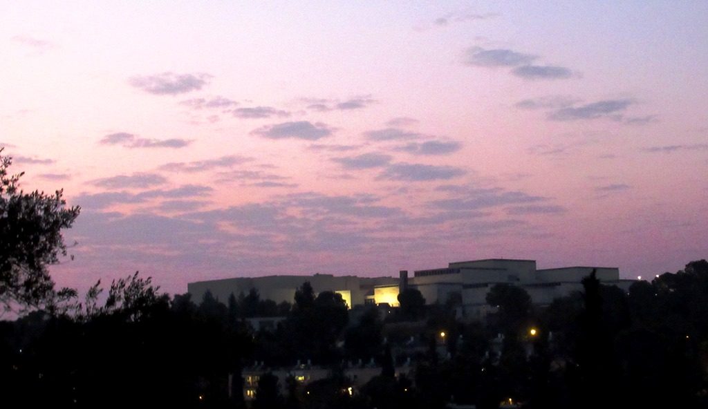 Light clouds in Jerusalem sky over Israel Museum at sunset