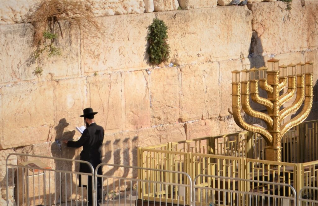 One man praying at Western Wall on Hanuka