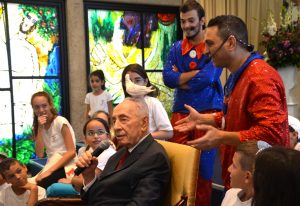 Performers at Beit Hanasi put dove on hear of President Shimon Peres